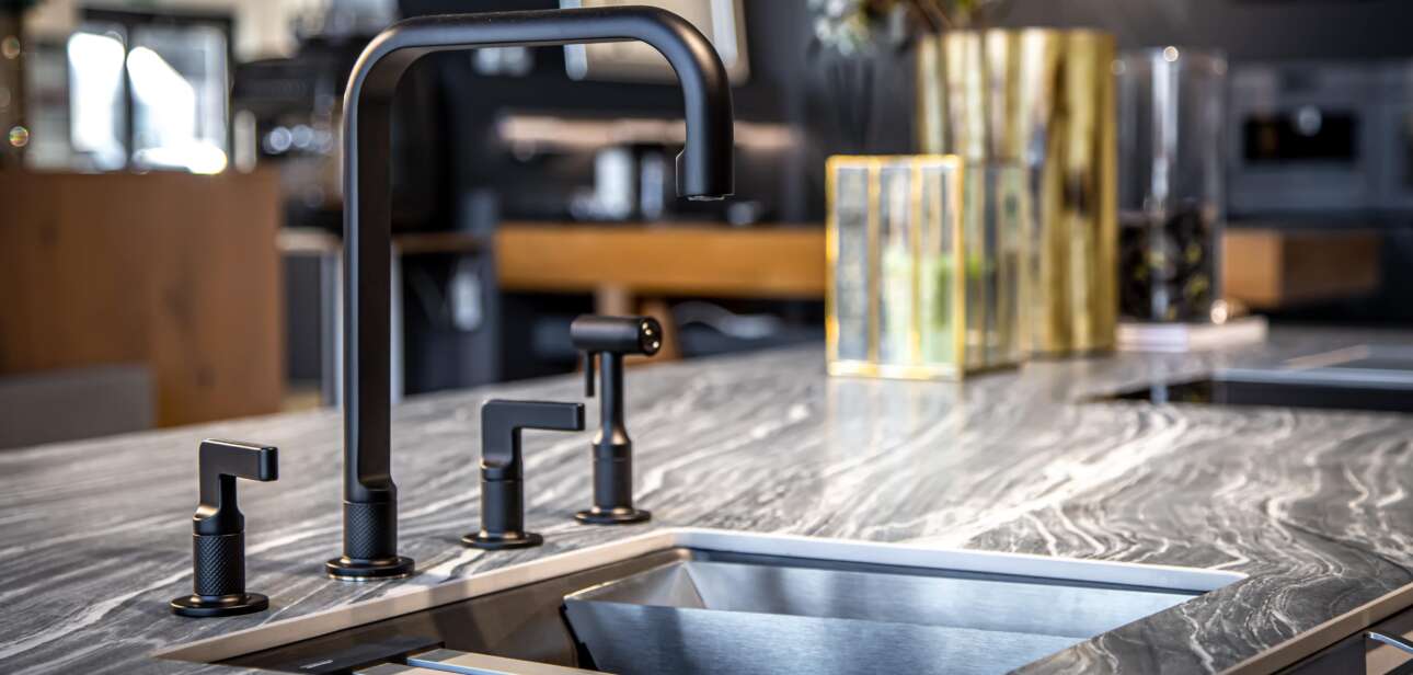black faucet with a steel sink in a stylish modern 2022 04 22 07 02 15 utc min