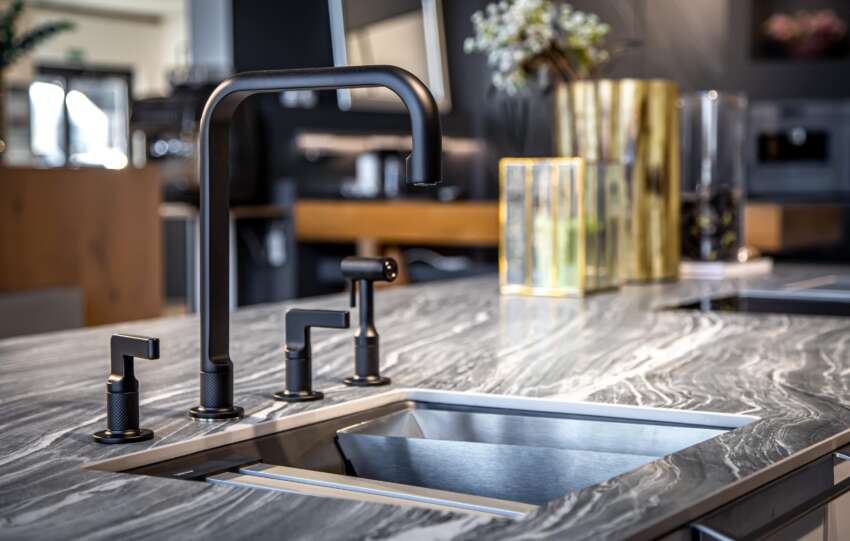 black faucet with a steel sink in a stylish modern 2022 04 22 07 02 15 utc min