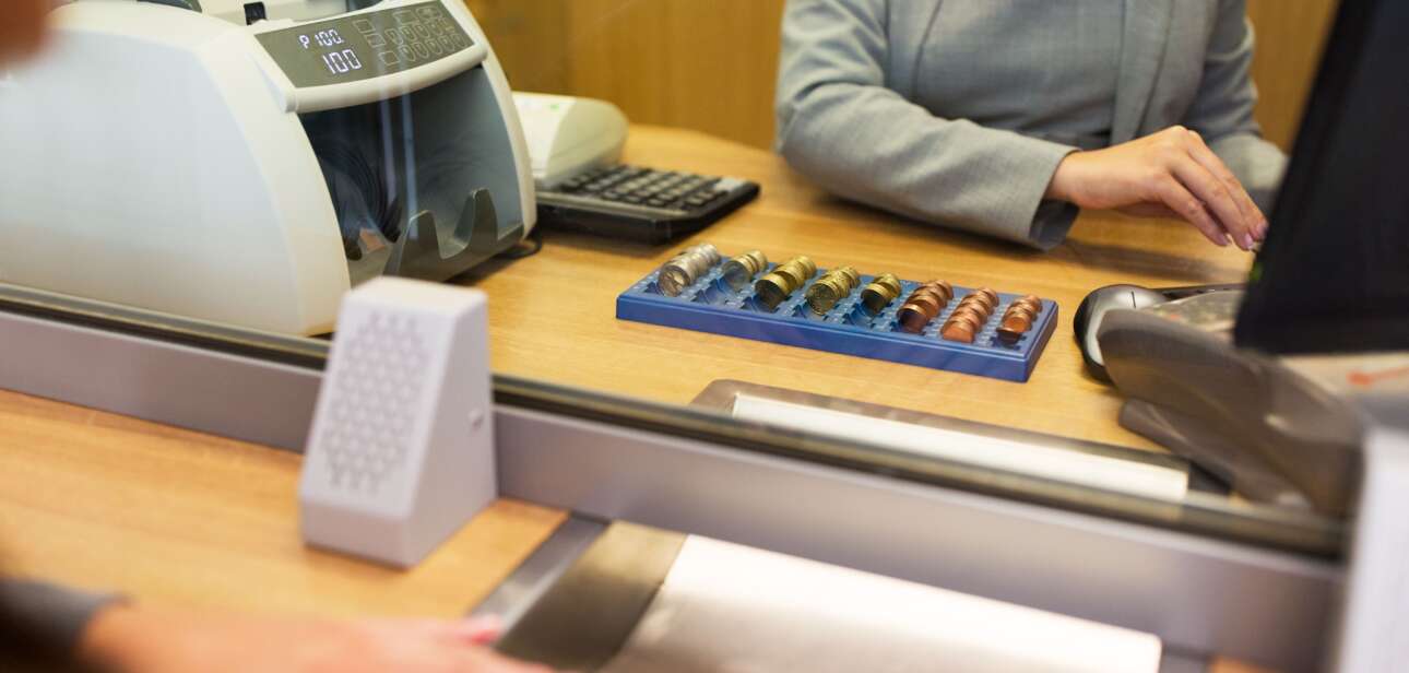 clerk counting cash money at bank office 2023 11 27 05 21 30 utc2 min